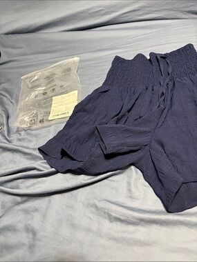 Smocked Waist Navy Blue Shorts size large elastic waist. Ties